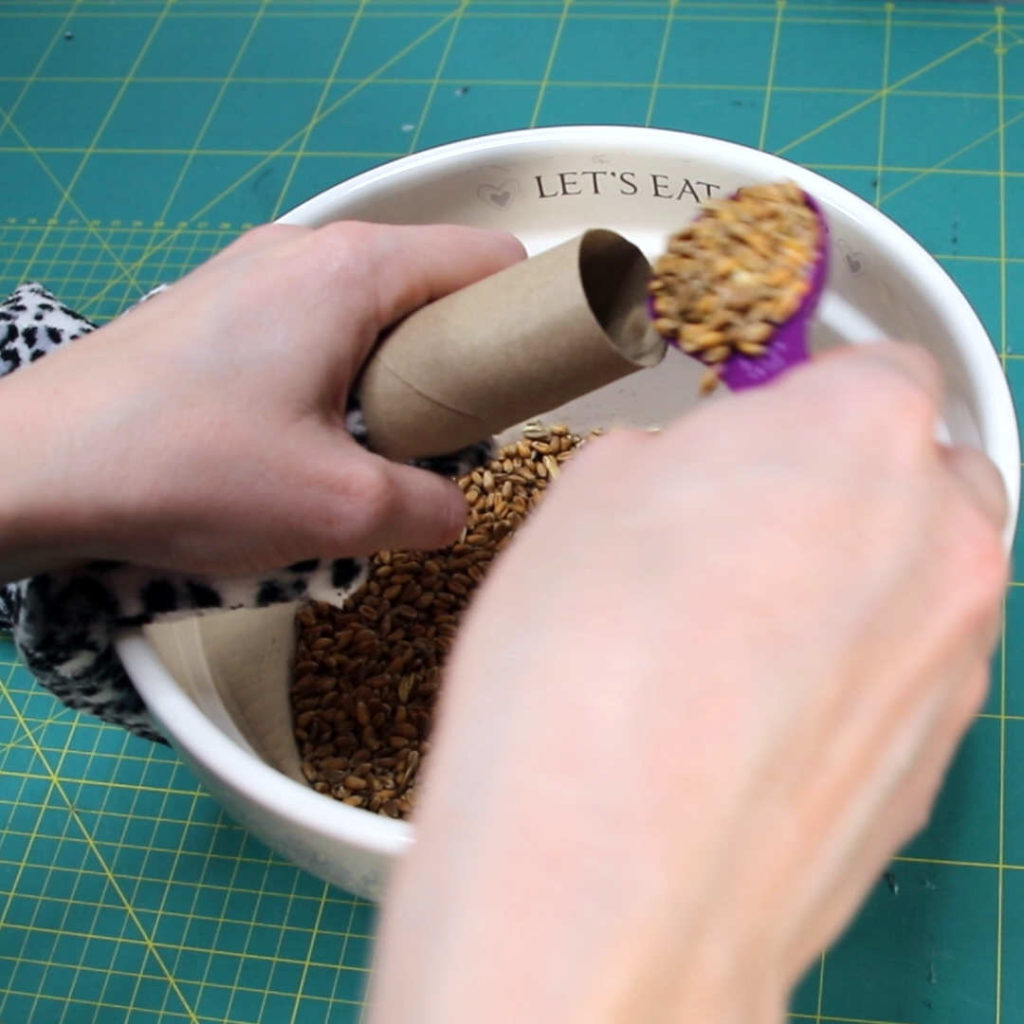 Image of the wheat and lavender mix being funnelled into the inside of the wheat bag