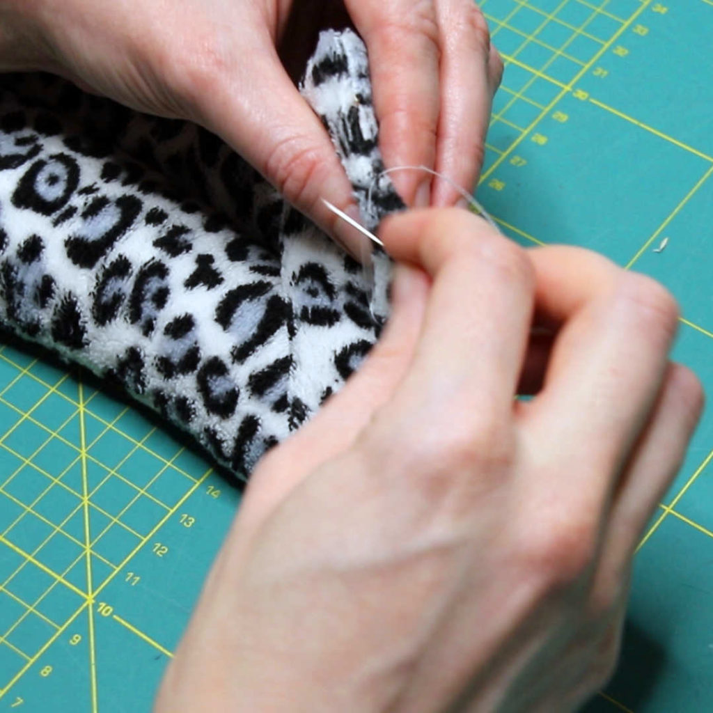 Image showing the opening of the wheat warmer being sewn shut with slip-stitch